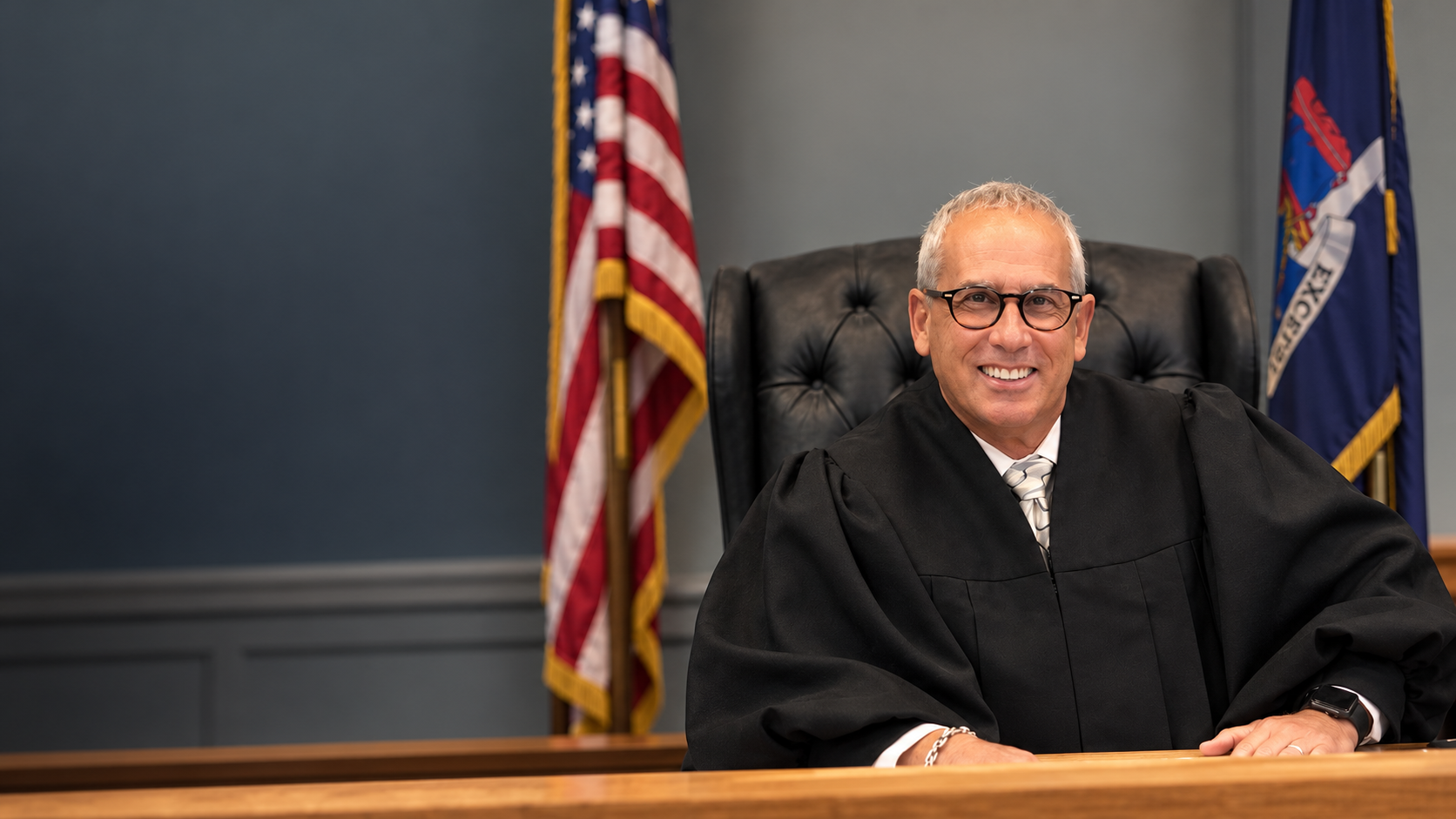 Judge Eric Sachs seated at the bench in his Suffolk County courtroom