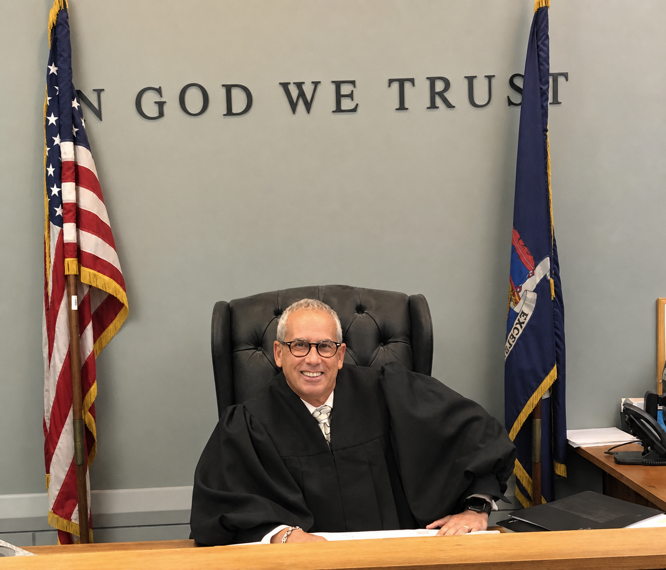 Judge Eric Sachs seated at the bench in his Suffolk County courtroom